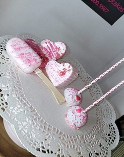 Pink and white cake pops and heart cake pops